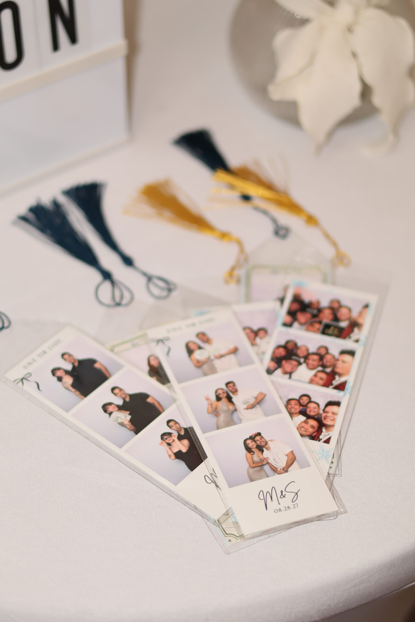 Bookmark Sleeves with sample pictures inserted to show it as an add-on to guests photo booth rental